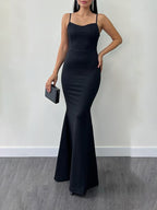 Black maxi dress with spaghetti straps and fitted mermaid hem