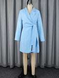Blue lapel wrap mini blazer dress on mannequin with long sleeves and front button placket