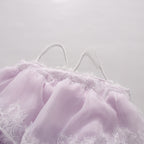 Lavender lace neckline and spaghetti straps on a tiered maxi slip dress