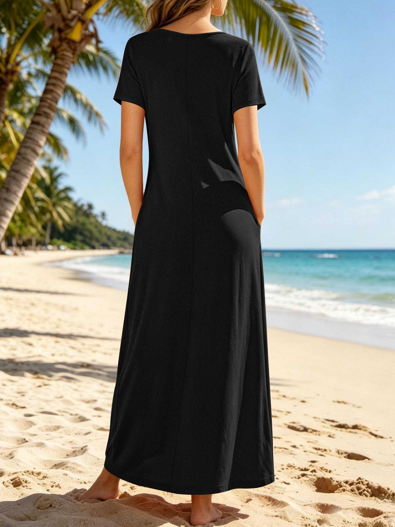 Black v-neck short sleeve maxi dress with pockets, loose fit, solid color, back view.