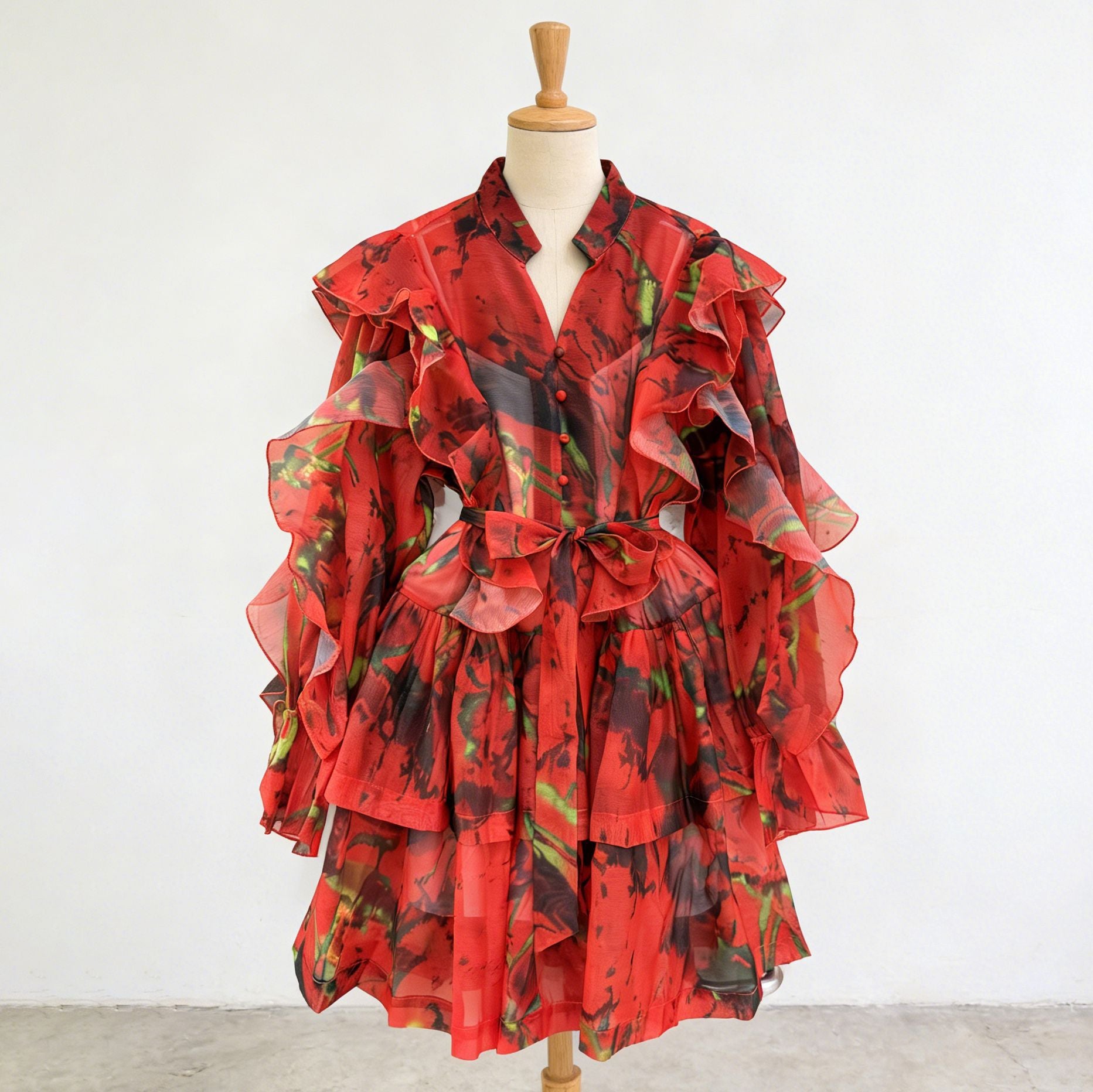 Red ruffle mini dress with V-neck and tie waist, layered flutter sleeve details.