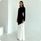 Round-neck long-sleeve dress with black fitted top and white pleated maxi skirt
