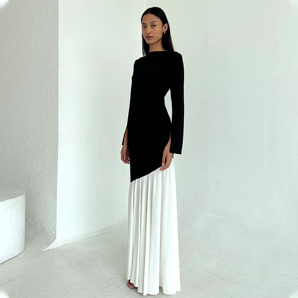 Round-neck long-sleeve dress with black fitted top and white pleated maxi skirt