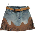Light blue denim mini skirt with tan waist belt and brown fringe tassel hem