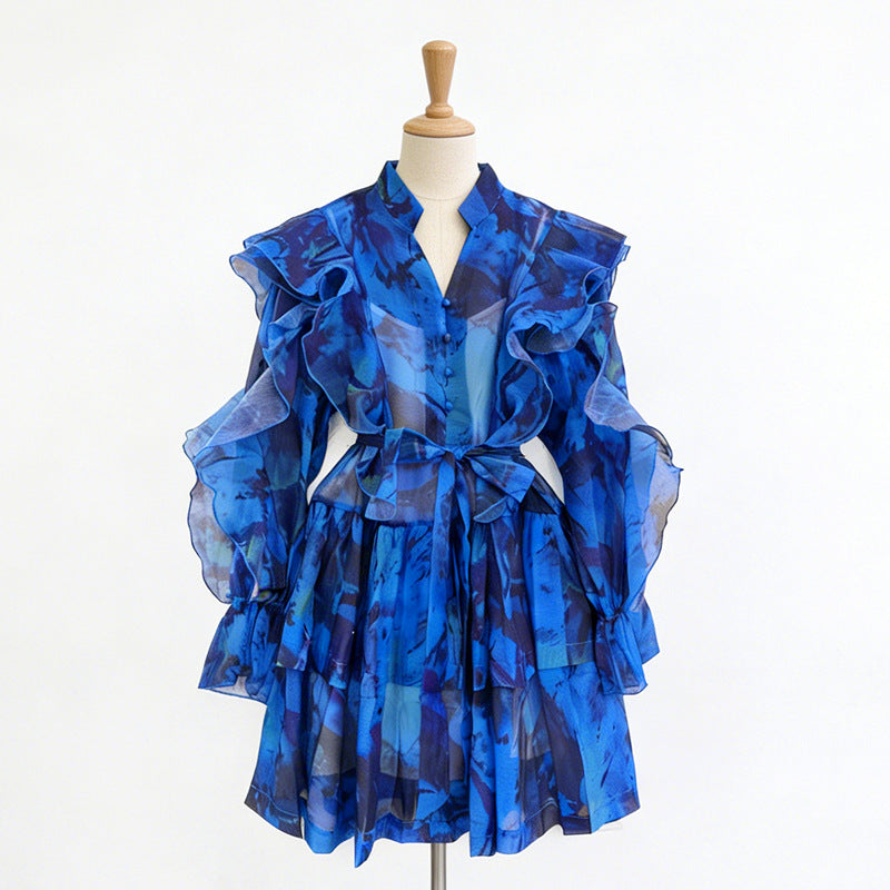 Blue ruffle mini dress with V-neck and tie waist, layered ruffled sleeves.