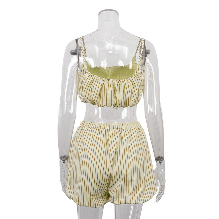 Yellow striped 3-piece lounge set on mannequin: ruffle crop top and high-waist shorts