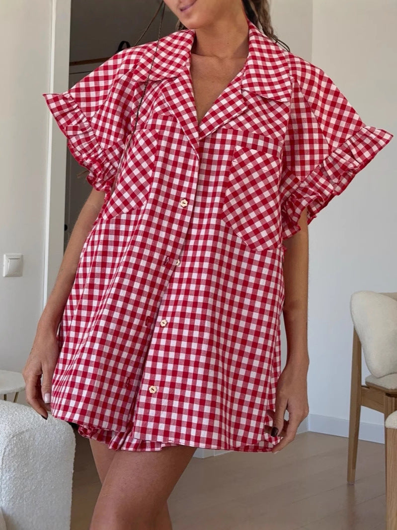 Red gingham ruffled button-front shirt with high-waisted shorts, side view