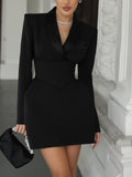 Black belted blazer mini dress with notched lapels and long sleeves