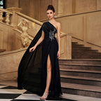 Black one-shoulder evening gown with jeweled beaded bodice, flowing skirt and thigh slit