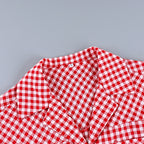 Red and white gingham shirt collar and button placket with ruffled shoulder detail