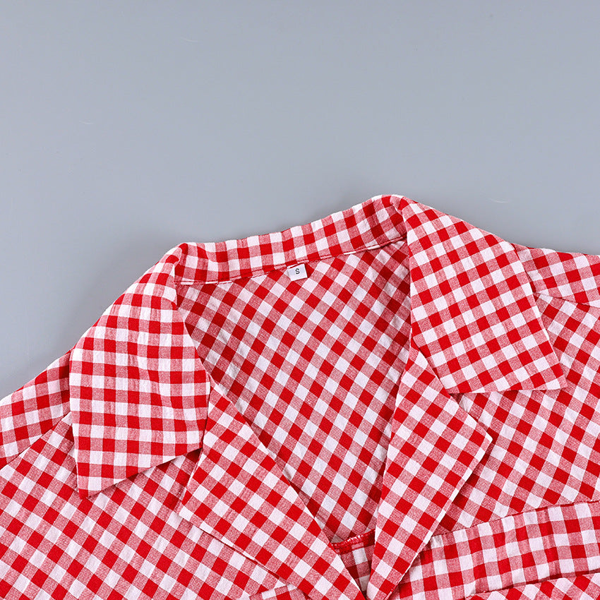 Red and white gingham shirt collar and button placket with ruffled shoulder detail