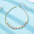 Gold-tone beaded necklace with starfish charms and small round bead accents
