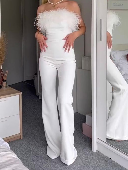 White off-shoulder jumpsuit featuring a feather boa neckline and fitted long feather cuffs