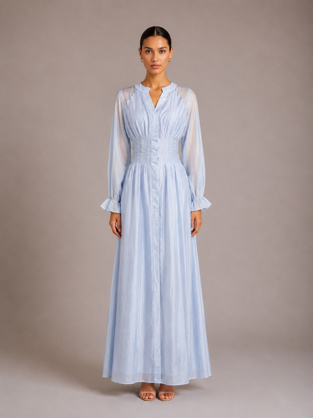 Light blue puff-sleeve button flowy dress with V-neck and gathered waist