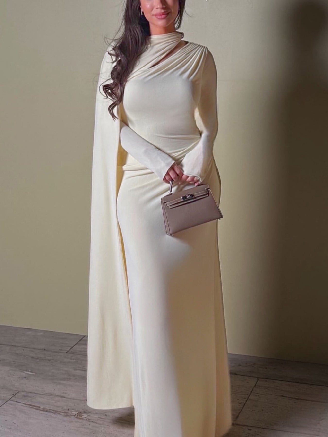 Light apricot long-sleeve maxi dress with draped neckline and slim fitted bodice