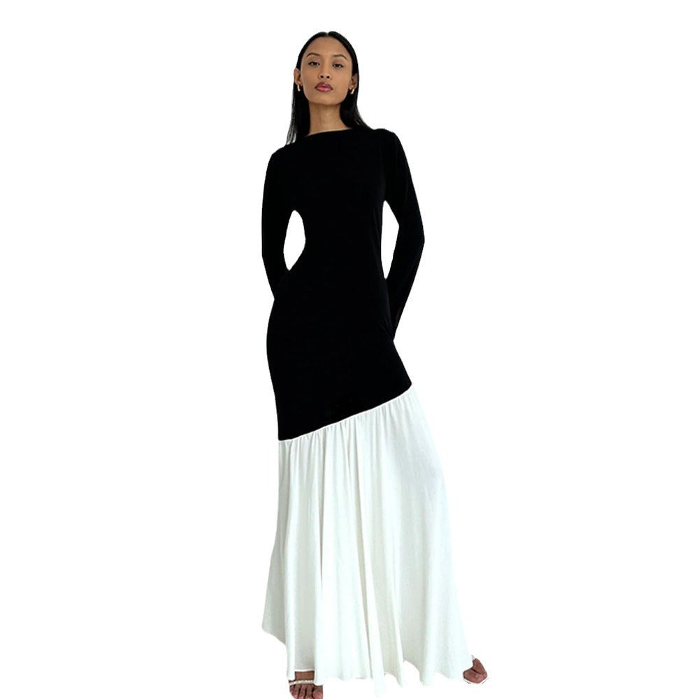 Round-neck long-sleeve dress with black bodice and white pleated skirt