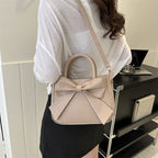 Khaki bow-trimmed small square handbag with shoulder strap and front bow