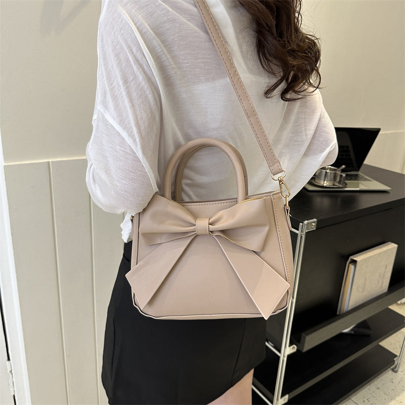 Khaki bow-trimmed small square handbag with shoulder strap and front bow