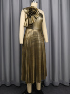 Gold one-shoulder pleated midi dress on mannequin with floral applique detail