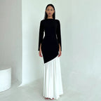 Front-view round-neck long-sleeve dress, black fitted bodice and white pleated skirt
