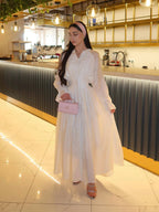 White puff-sleeve button flowy dress with V-neck and ruffled cuffs