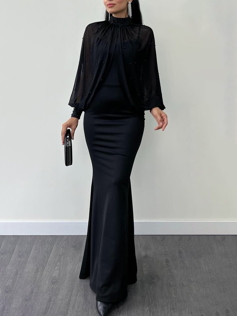 Black maxi dress with sheer high neck and long sleeves