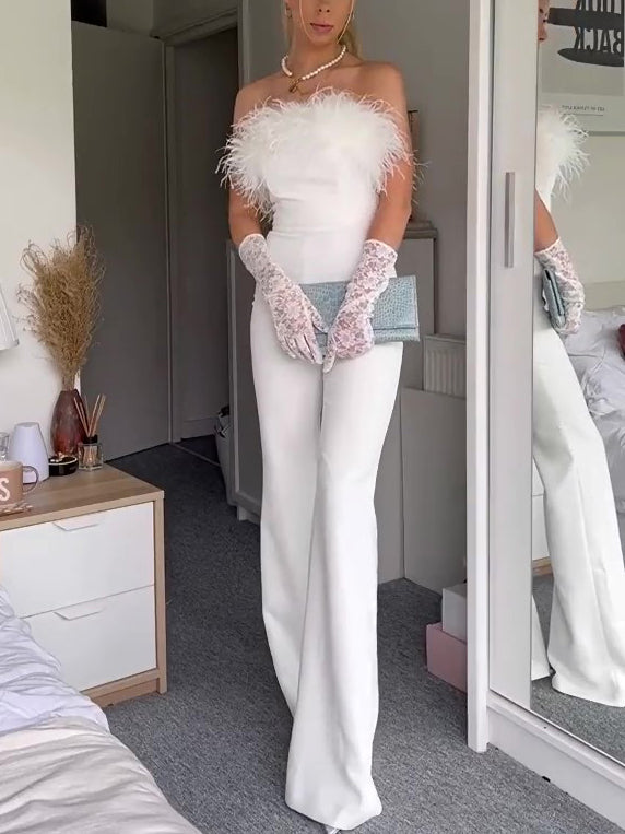 White strapless wide-leg jumpsuit with fluffy feather trim at the neckline and cuffs