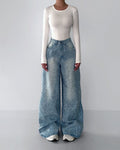 Rhinestone-studded blue wide-leg jeans with high waist and scattered front sparkle