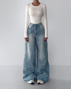 Rhinestone-studded blue wide-leg jeans with high waist and scattered front sparkle