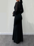 Black maxi dress with long sleeves and fitted mermaid silhouette
