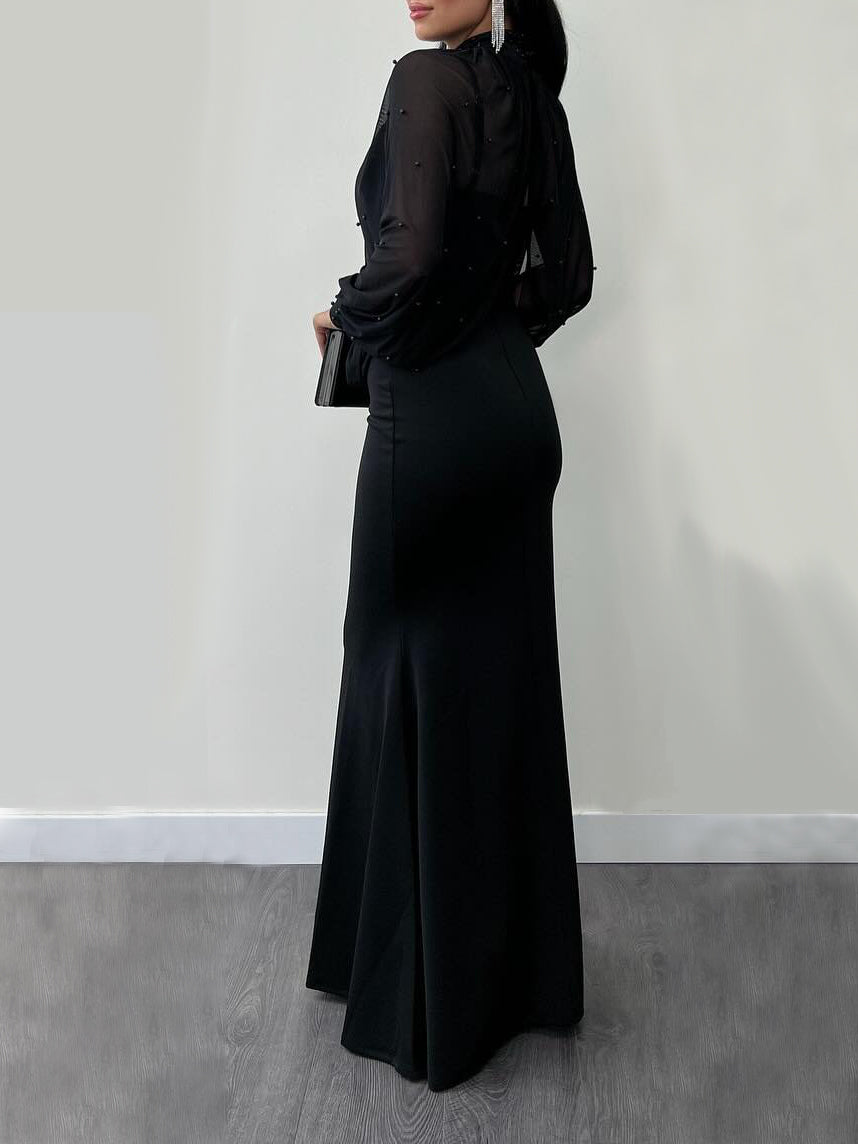 Black maxi dress with long sleeves and fitted mermaid silhouette