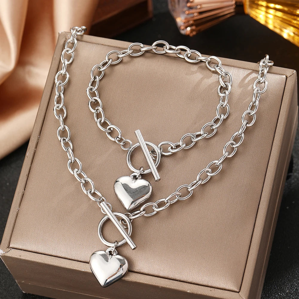 Silver-tone heart pendant bracelet and necklace set with heart charms and toggle bar clasp