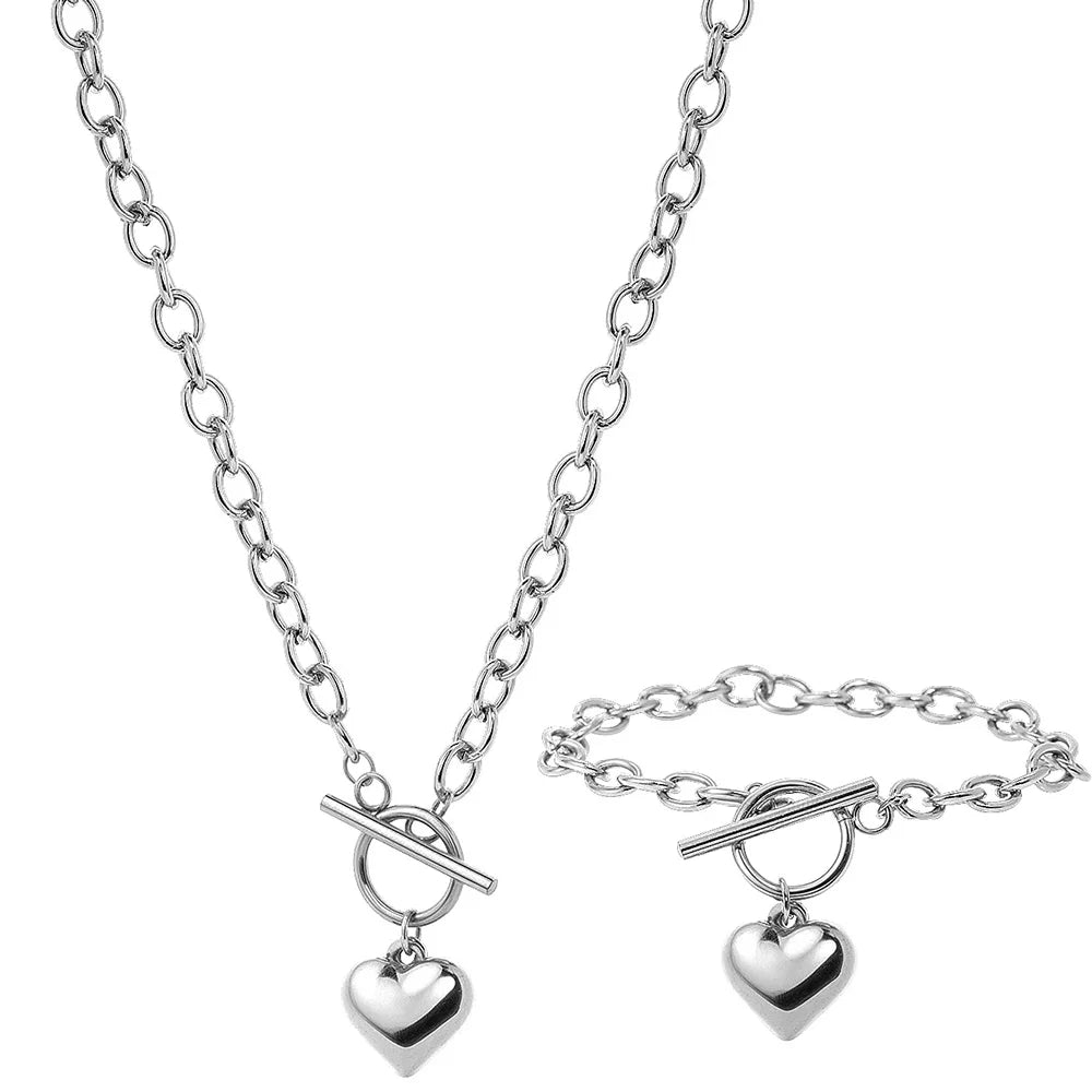Silver-tone chain necklace set with heart pendants and toggle bar clasp