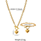 Gold-tone heart pendant necklace and bracelet set with heart charms on linked chain