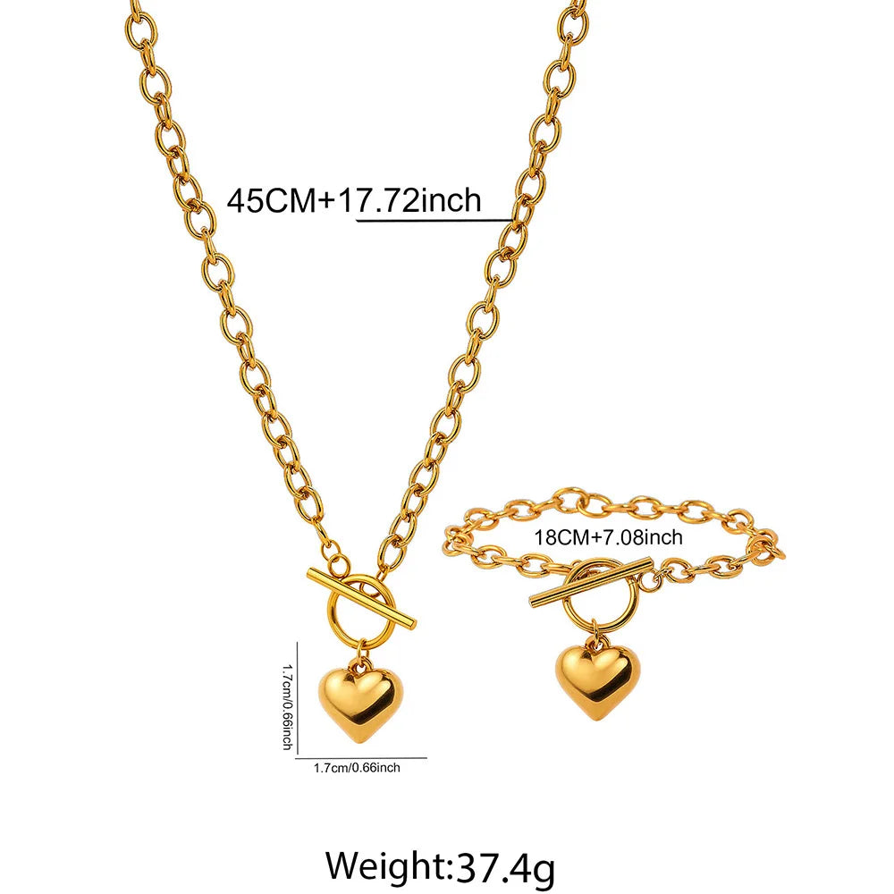Gold-tone heart pendant necklace and bracelet set with heart charms on linked chain