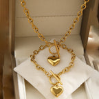 Gold-tone heart charm necklace set with double chain and small heart pendants