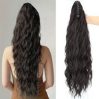 Long black synthetic wavy ponytail extension with comb clip base, side view