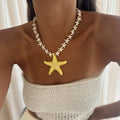 Starfish pendant necklace with white star-link chain and yellow starfish charm