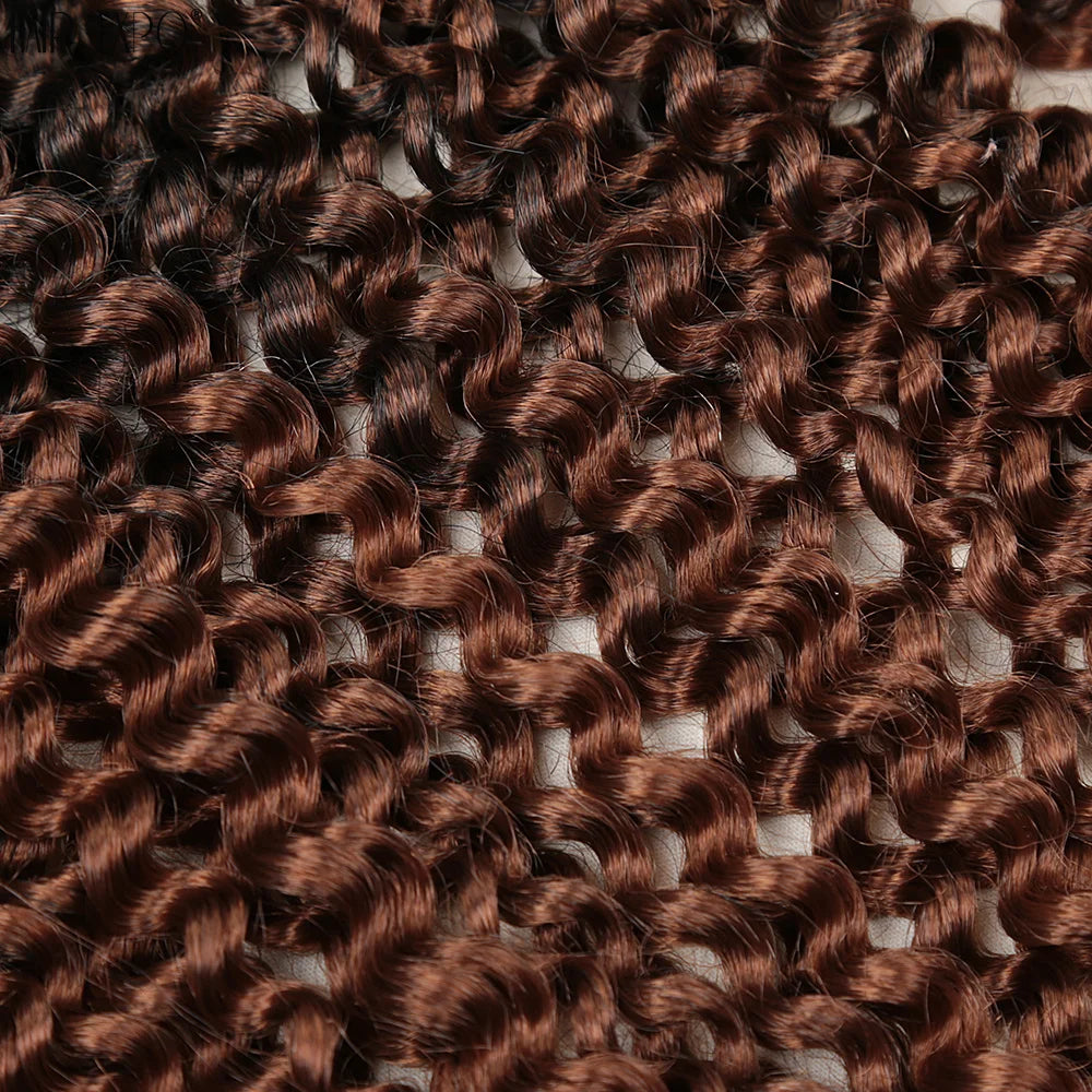 Crochet hair extensions with tight water-wave curls in warm brown ombre.