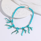 Turquoise coral branch charm bead necklace with silver chain and round silver spacer beads