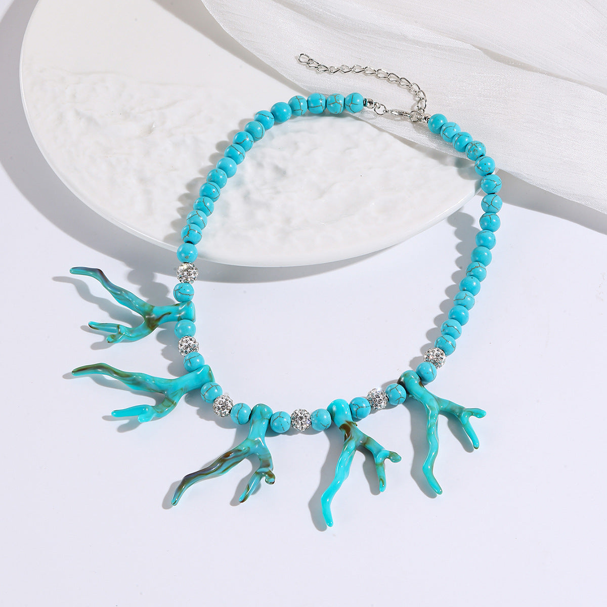 Turquoise coral branch charm bead necklace with silver chain and round silver spacer beads