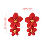 Red double-layer flower dangle earrings with gold-tone star centers, drop style