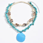 Turquoise beaded conch rope necklace with starfish charms and blue scallop shell pendant