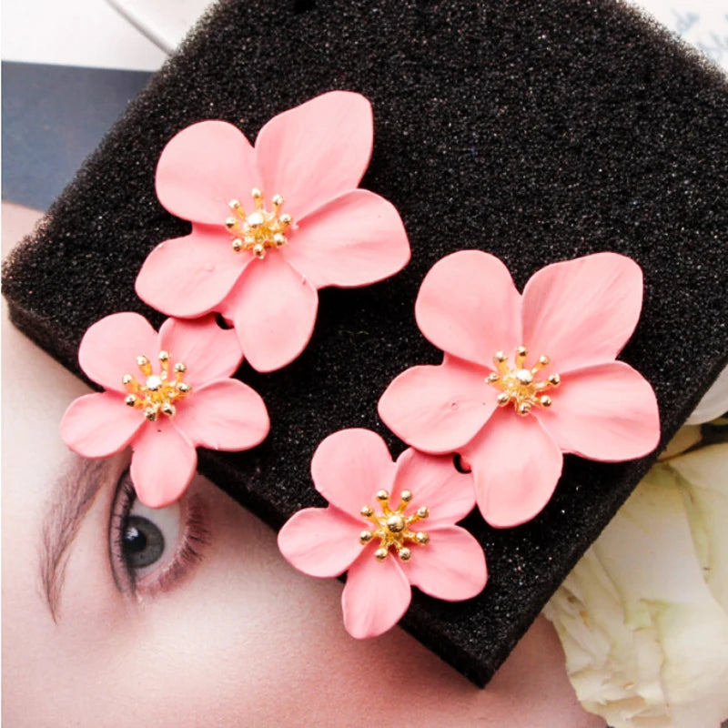 Pink double-layer flower dangle earrings with gold-tone centers, two stacked petals, pair