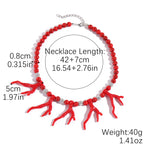 Red coral branch charm bead necklace with silver chain and round silver spacer beads