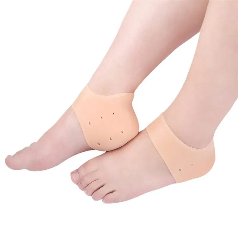 Skin-tone gel heel socks with curved toe pads and dotted massage nubs