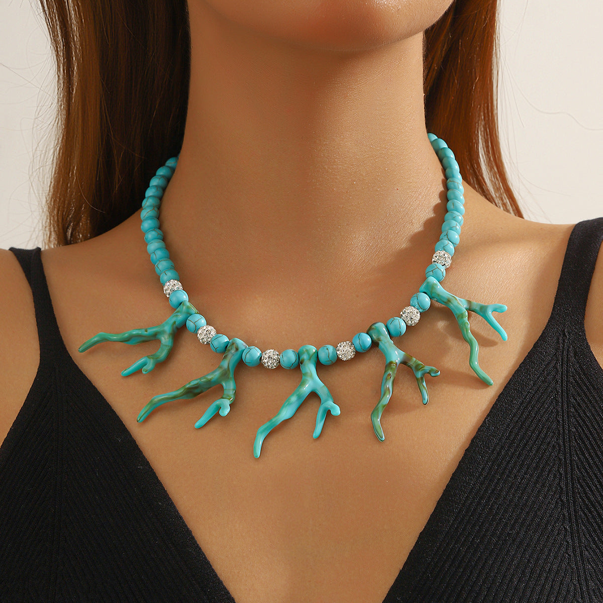 Turquoise bead pendant necklace with coral branch charms and small silver spacers