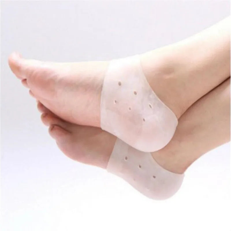 Gel heel socks in off-white worn over the feet, with small vent holes on the heel