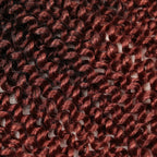 Crochet hair extensions close-up, maroon and dark brown wavy curl texture
