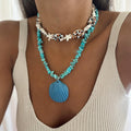Turquoise conch rope necklace with starfish charms and blue scallop shell pendant
